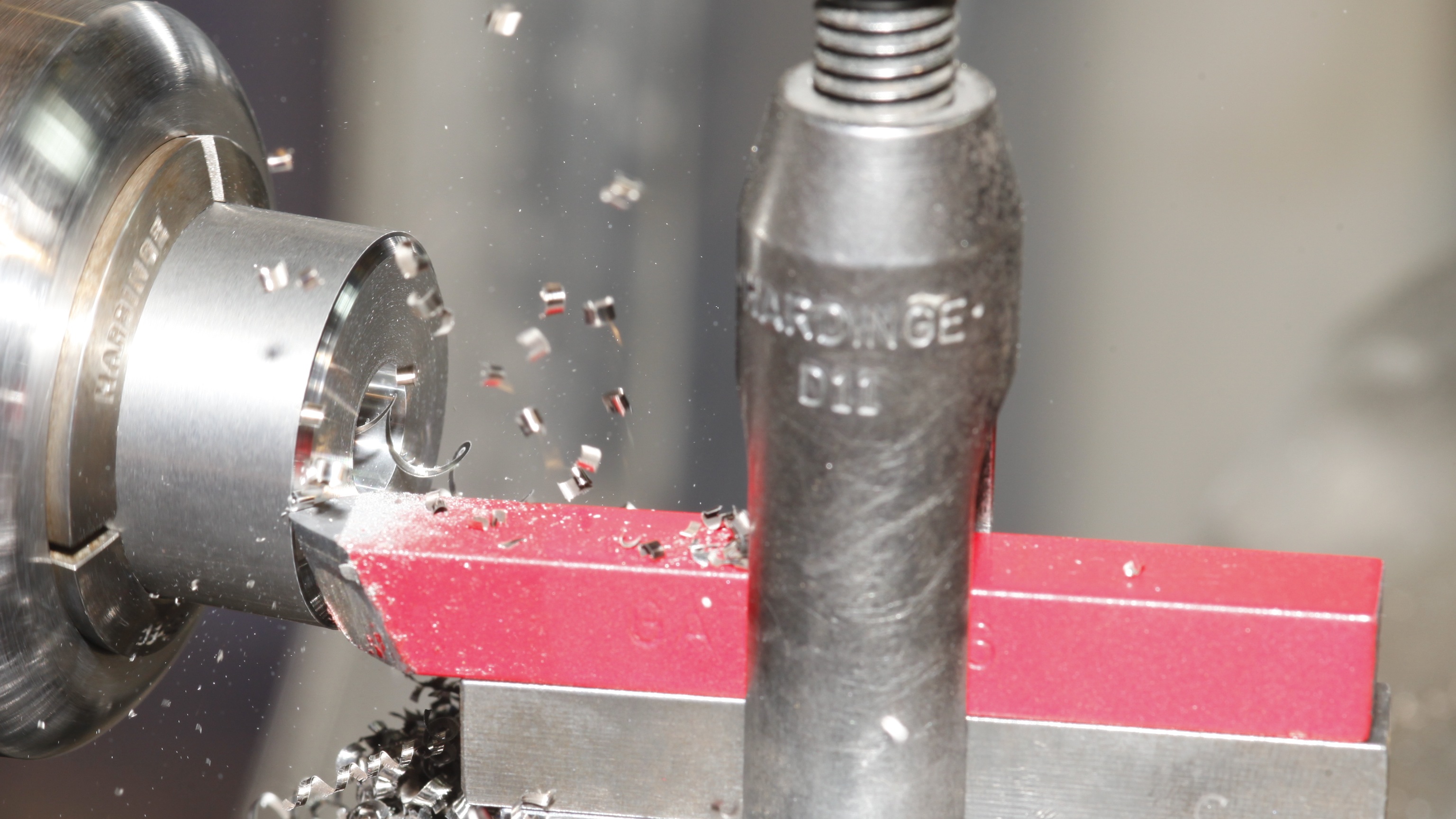 Our red tool cutting a carbide nib